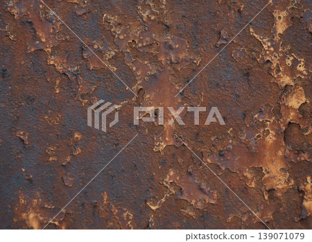 Detailed view of a heavily corroded metal surface featuring peeling layers of rich brown and dark orange rust Detailed view of a heavily corroded metal surface featuring peeling layers of rich brown and dark orange rust 139071079