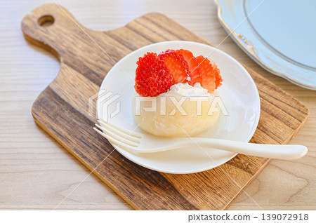 A mochi-style dessert with strawberries and whipped cream. A mochi-style dessert with strawberries and whipped cream. 139072918