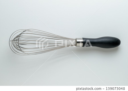 A top-down view of a whisk (white background, with space for copy). A top-down view of a whisk (white background, with space for copy). 139073048