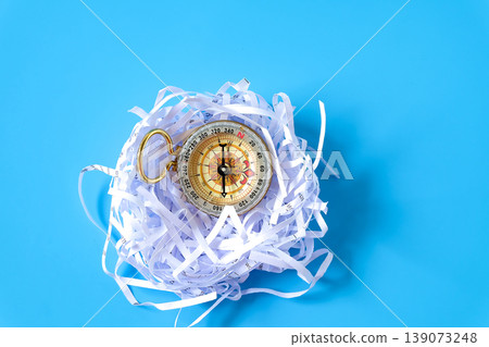 Vintage Compass in shredded paper. Vintage Compass in shredded paper. 139073248