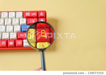 A magnifying glass on keyboard gamer,Internet search concept. A magnifying glass on keyboard gamer,Internet search concept. 139073350
