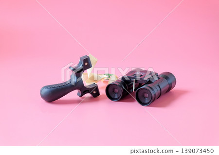 Slingshot and binoculars for sport game,Hunting wildlife game. Slingshot and binoculars for sport game,Hunting wildlife game. 139073450