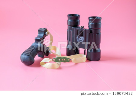 Slingshot and binoculars for sport game,Hunting wildlife game. Slingshot and binoculars for sport game,Hunting wildlife game. 139073452