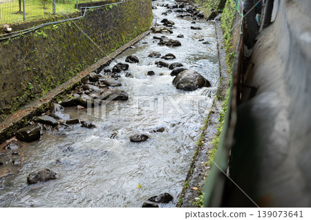 Man-Made Canal with Rock Bottom and Concrete Embankment Man-Made Canal with Rock Bottom and Concrete Embankment 139073641