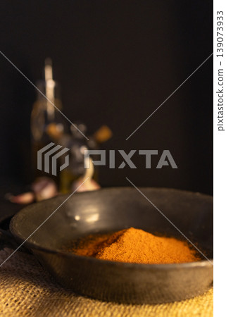 Red paprika on a rustic plate in a country kitchen. Dark background Red paprika on a rustic plate in a country kitchen. Dark background 139073933