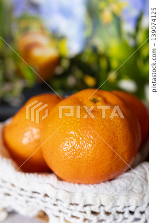 Close up mandarins fruit or tangerine in a garden background Close up mandarins fruit or tangerine in a garden background 139074125