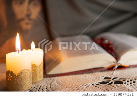 Bible and rosary illuminated by candlelight.Culture of faith Bible and rosary illuminated by candlelight.Culture of faith 139074151