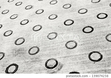 A concrete floor with a round ring-shaped depression A concrete floor with a round ring-shaped depression 139074238