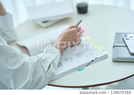 woman studying by text 139074388
