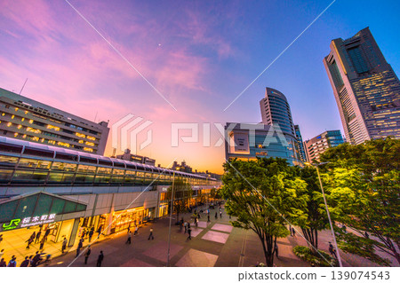 New cityscape of Yokohama, Japan, April 21st. A view of Sakuragicho Station and Yokohama Landmark Tower illuminated by the sunset. New cityscape of Yokohama, Japan, April 21st. A view of Sakuragicho Station and Yokohama Landmark Tower illuminated by the sunset. 139074543