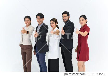 Group portrait of Young Asian Businesspeople standing in a row smiling and showing thumbs up, happy professional team people recommend best corporate service. Isolate on white background. looking at Group portrait of Young Asian Businesspeople standing in a row smiling and showing thumbs up, happy professional team people recommend best corporate service. Isolate on white background. looking at 139074546