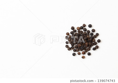 Black pepper on a white background Black pepper on a white background 139074743