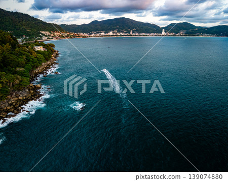 Aerial flying drone view seashore waves water surface texture in sunny tropical ocean at Phuket island Thailand Aerial flying drone view seashore waves water surface texture in sunny tropical ocean at Phuket island Thailand 139074880