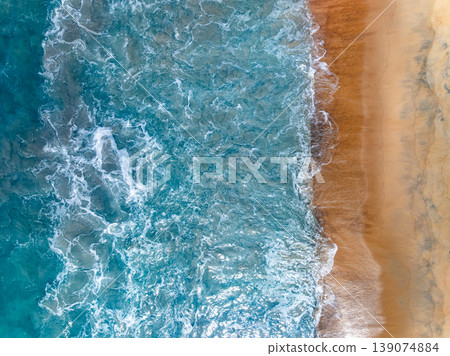 Beautiful wave crashing on sandy shore at beach in phuket thailand Beautiful wave crashing on sandy shore at beach in phuket thailand 139074884