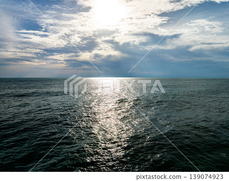 Aerial flying drone view seashore waves water surface texture in sunny tropical ocean at Phuket island Thailand Aerial flying drone view seashore waves water surface texture in sunny tropical ocean at Phuket island Thailand 139074923