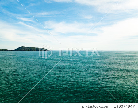 Aerial flying drone view seashore waves water surface texture in sunny tropical ocean at Phuket island Thailand Aerial flying drone view seashore waves water surface texture in sunny tropical ocean at Phuket island Thailand 139074947