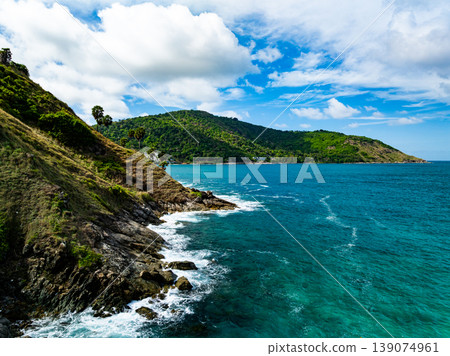 Aerial flying drone view seashore waves water surface texture in sunny tropical ocean at Phuket island Thailand 139074961