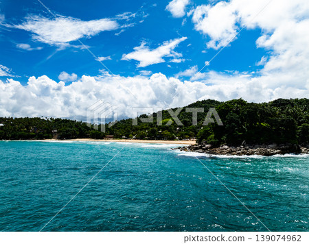 Aerial flying drone view seashore waves water surface texture in sunny tropical ocean at Phuket island Thailand Aerial flying drone view seashore waves water surface texture in sunny tropical ocean at Phuket island Thailand 139074962