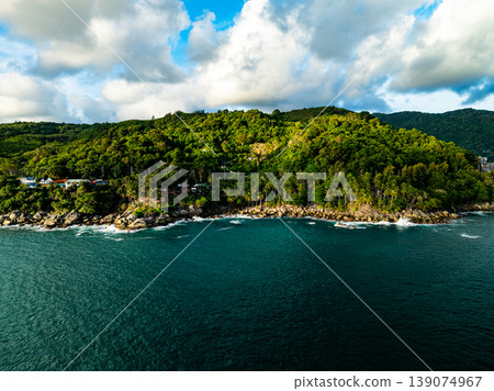 Aerial flying drone view seashore waves water surface texture in sunny tropical ocean at Phuket island Thailand Aerial flying drone view seashore waves water surface texture in sunny tropical ocean at Phuket island Thailand 139074967