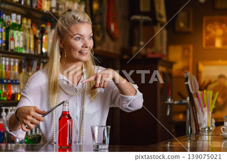 Woman working at the bar counter Woman working at the bar counter 139075021