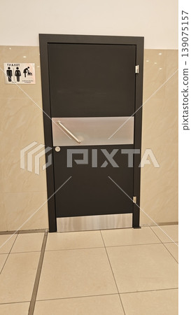 Door leading to restroom with clear signage indicating gender at a public place Door leading to restroom with clear signage indicating gender at a public place 139075157