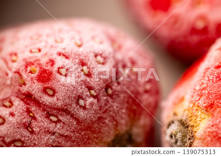 Frosty, thawing, bright red strawberries: ultimate macro close-up Frosty, thawing, bright red strawberries: ultimate macro close-up 139075313