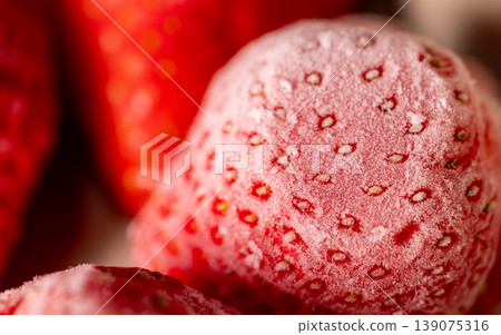 Frosty, thawing, bright red strawberries: ultimate macro close-up Frosty, thawing, bright red strawberries: ultimate macro close-up 139075316
