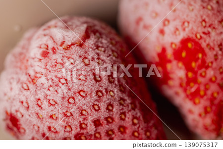 Frosty, thawing, bright red strawberries: ultimate macro close-up Frosty, thawing, bright red strawberries: ultimate macro close-up 139075317
