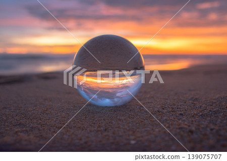 view of colorful sky at the beach inside crystal ball. view of colorful sky at the beach inside crystal ball. 139075707
