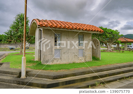 The cloudy sky and the tranquility of the seashore create a memorable scene of the rainy season at Ishigaki Island's port. The cloudy sky and the tranquility of the seashore create a memorable scene of the rainy season at Ishigaki Island's port. 139075770