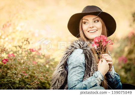 Young lady relaxing in garden Young lady relaxing in garden 139075849