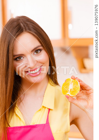 Female cook holding fruit. Female cook holding fruit. 139075976