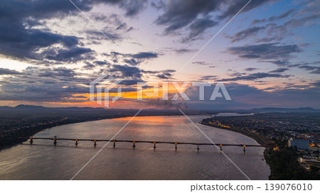 Aerial view of Sunrise Sunset and Daily Life Around Pakse Great Mekong Bridge. Aerial view of Sunrise Sunset and Daily Life Around Pakse Great Mekong Bridge. 139076010