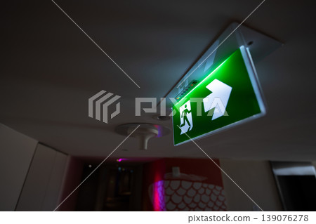 The illuminated panel supports navigation and rapid response, reinforcing compliance and structured emergency movement toward a safe exit in buildings. The illuminated panel supports navigation and rapid response, reinforcing compliance and structured emergency movement toward a safe exit in buildings. 139076278