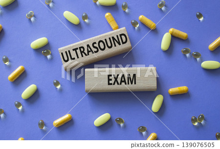 Ultrasound Exam symbol. Concept word Ultrasound Exam on wooden blocks. Beautiful purple background with pills. Medicine and Ultrasound Exam. Copy space Ultrasound Exam symbol. Concept word Ultrasound Exam on wooden blocks. Beautiful purple background with pills. Medicine and Ultrasound Exam. Copy space 139076505