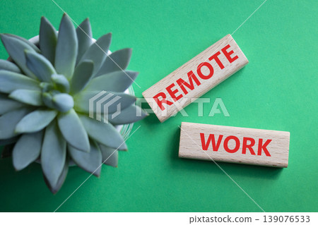 REMOTE WORK symbol. Concept word REMOTE WORK on wooden blocks. Beautiful green background with succulent plant. Business and REMOTE WORK concept. Copy space REMOTE WORK symbol. Concept word REMOTE WORK on wooden blocks. Beautiful green background with succulent plant. Business and REMOTE WORK concept. Copy space 139076533