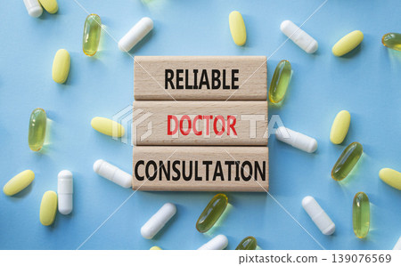 Reliable doctor consultation symbol. Concept words Reliable doctor consultation on wooden blocks. Beautiful blue background with pills. Healthcare and Reliable doctor consultation concept. Copy space. Reliable doctor consultation symbol. Concept words Reliable doctor consultation on wooden blocks. Beautiful blue background with pills. Healthcare and Reliable doctor consultation concept. Copy space. 139076569
