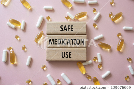 Safe Medication Use symbol. Concept words Safe Medication Use on wooden blocks. Beautiful pink background with pills. Healthcare and Safe Medication Use concept. Copy space. Safe Medication Use symbol. Concept words Safe Medication Use on wooden blocks. Beautiful pink background with pills. Healthcare and Safe Medication Use concept. Copy space. 139076609