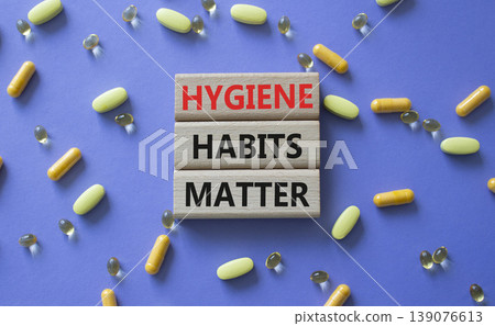 Hygiene Habits Matter symbol. Concept words Hygiene Habits Matter on wooden blocks. Beautiful purple background with pills. Healthcare and Hygiene Habits Matter concept. Copy space. Hygiene Habits Matter symbol. Concept words Hygiene Habits Matter on wooden blocks. Beautiful purple background with pills. Healthcare and Hygiene Habits Matter concept. Copy space. 139076613