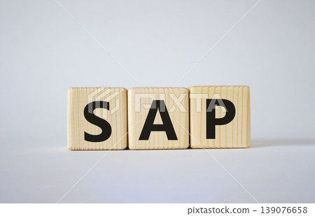 SAP - Systems Applications Products. Wooden cubes with word SAP. Beautiful white background. Business and System Application Product concept. Copy space. SAP - Systems Applications Products. Wooden cubes with word SAP. Beautiful white background. Business and System Application Product concept. Copy space. 139076658