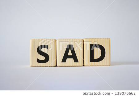 Sad symbol. Wooden cubes with words Sad. Beautiful white background. Business and Sad concept. Copy space. 139076662
