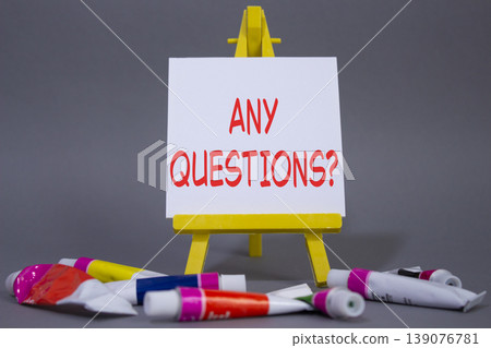 Any Questions symbol. Wooden blocks with words Any Questions . Beautiful grey background with paints and easel. Business and Any Questions concept. Copy space. Any Questions symbol. Wooden blocks with words Any Questions . Beautiful grey background with paints and easel. Business and Any Questions concept. Copy space. 139076781