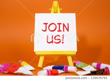 Join us symbol. Concept word Join us on wooden blocks. Beautiful orange background with paints and easel. Business and Join us concept. Copy space Join us symbol. Concept word Join us on wooden blocks. Beautiful orange background with paints and easel. Business and Join us concept. Copy space 139076785