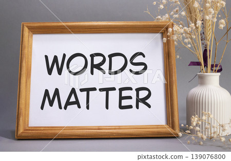 Words Matter symbol. Concept words Words Matter on beautiful wooden picture frame. Beautiful grey background with flower vase. Business and Words Matter concept. Copy space. Words Matter symbol. Concept words Words Matter on beautiful wooden picture frame. Beautiful grey background with flower vase. Business and Words Matter concept. Copy space. 139076800
