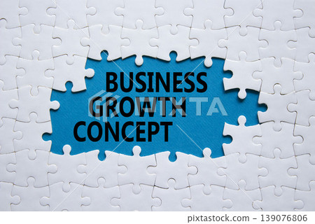 Business Growth Concept symbol. White puzzle with words Business Growth Concept. Beautiful blue background. Business concept. Copy space. Business Growth Concept symbol. White puzzle with words Business Growth Concept. Beautiful blue background. Business concept. Copy space. 139076806