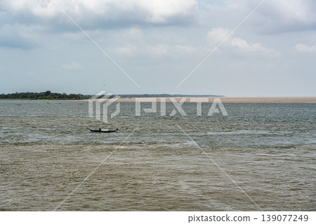 The meeting of the blue waters of the Tapajos River and muddy of the Amazon River in Santarem, Para State, Brazil. The meeting of the blue waters of the Tapajos River and muddy of the Amazon River in Santarem, Para State, Brazil. 139077249