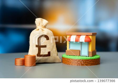 A store and a british pounds money bag represent business income and profit. Grants, subsidies, and financial support help small businesses grow and succeed. Retail investments and funding. A store and a british pounds money bag represent business income and profit. Grants, subsidies, and financial support help small businesses grow and succeed. Retail investments and funding. 139077366