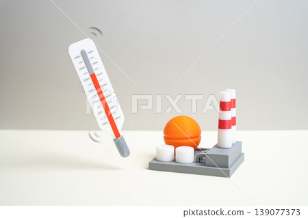 An industrial plant and a thermometer assess the economic health of industry. Investment attractiveness and productivity trends signal growth or slowdown in manufacturing and production sectors. An industrial plant and a thermometer assess the economic health of industry. Investment attractiveness and productivity trends signal growth or slowdown in manufacturing and production sectors. 139077373
