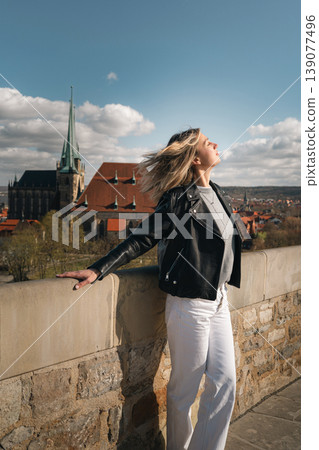 Woman Enjoying Sunlight at Scenic European Viewpoint 139077496