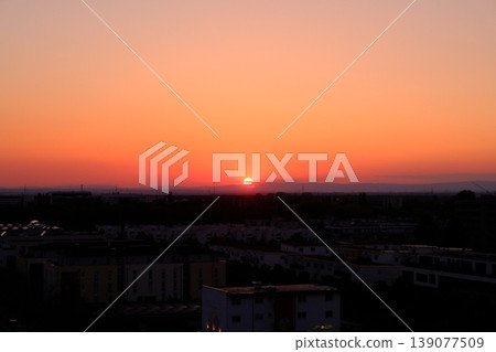 sunset over city 139077509
